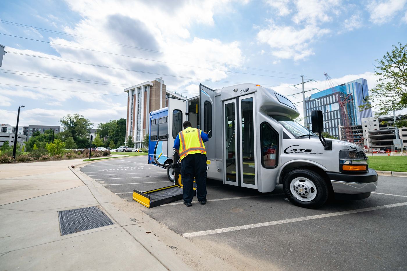 A CATS paratransit vehicle with a wheelchair ramp deployed