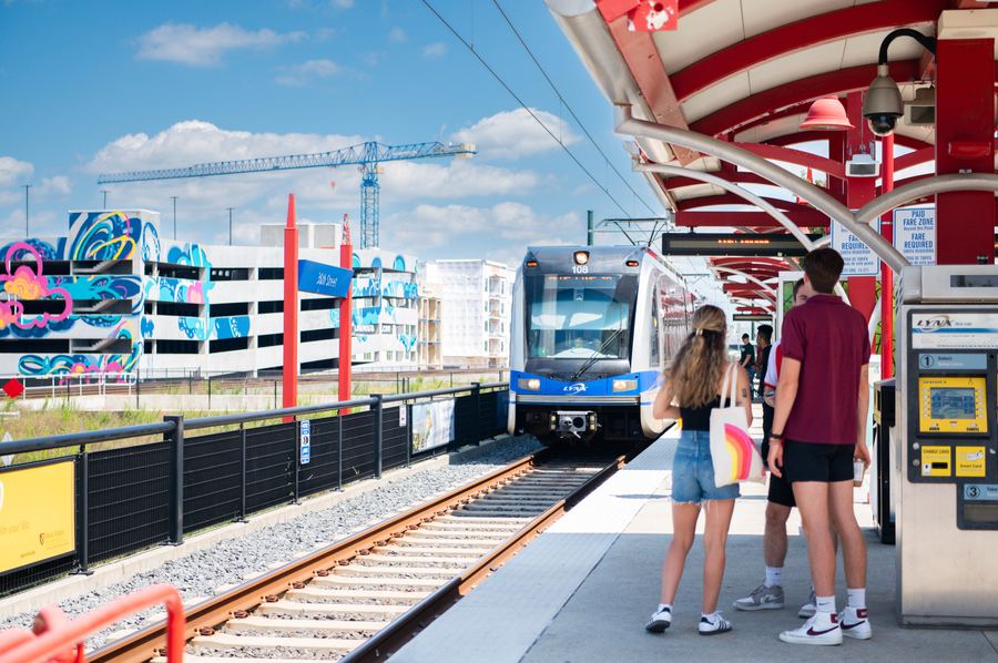 Riders waiting for a LYNX Blue Line train at a Charlotte station